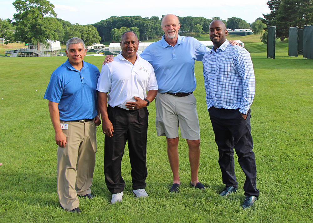 Pictured: (L-R) Village COO Hector Glynn, Fatherhood Engagement Services Supervisor Don Crocker, Tournament Chair Brian Reilly and Village client and event speaker Devon Kempson.
