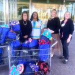 The Cigna Group donated “snuggle packs” filled with cozy, soft blankets for children at our preschool.