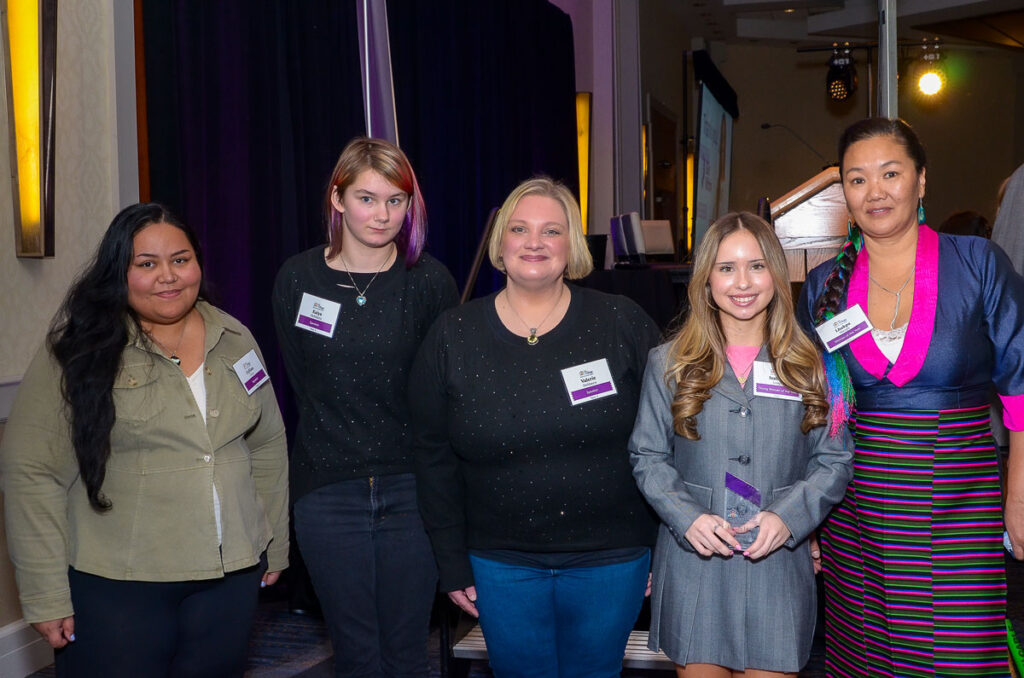 Honorees and client speakers at the 2024 Girl Within event. (L-R) Village client Gyllian, former Village foster youth Kaiya and her adoptive mother Valerie, Young Woman of the Year Isabella Longo and Woman of the Year Lhakpa Sherpa.